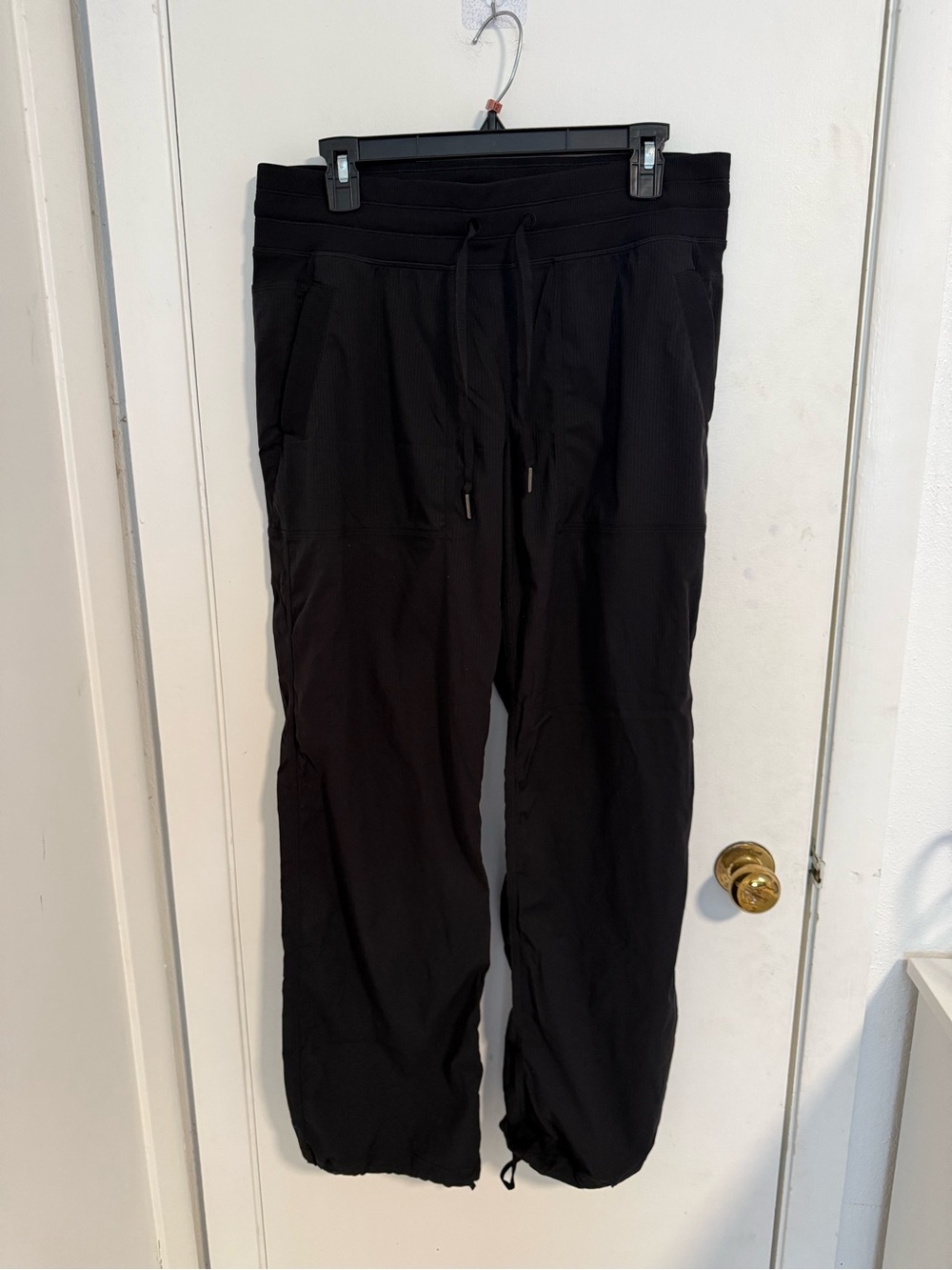 Size L Lululemon dance studio pants drawstring pockets in color black